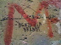 The infamous “Kilroy was here” graffiti on a piece of the Berlin Wall located in the Newseum in Washington, D.C., USA.