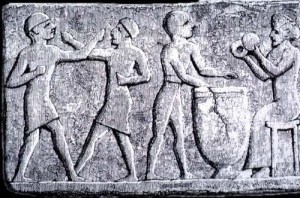 Terracotta relief depicting two men boxing to musical accompaniment, c. 1200 B.C.E., Sinkara (modern-day Tell as Senkereh, Iraq). Source: Flickr at www.flickr.com/photos/pankration (Pankration Research Institute's photostream).