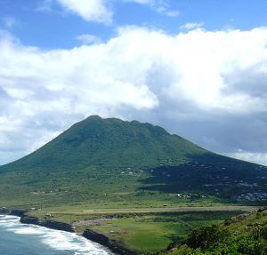 The dormant Quill Volcano in St. Eustatius. The end of the runway at  F.D. Roosevelt Airport can even be seen at the base of the volcano.