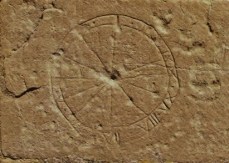Sundial etched onto a church wall. Credit: Lincolnshire Medieval Graffiti Project